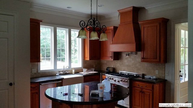 Finished kitchen with warm wood cabinets - project photo from the business's own gallery